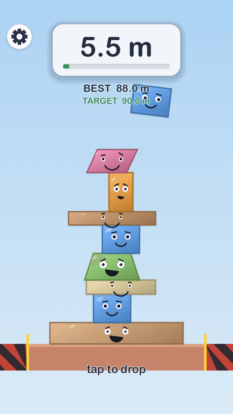A Stackfall tower of smiling character blocks, with the next piece swinging above it and a preview card showing what comes next
